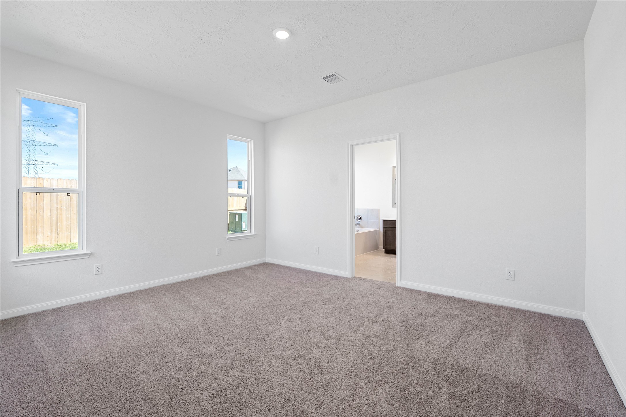 6423 Kentfield Drive Rosharon, TX 77583 - Photo 17 of 26 Unwind in your private sanctuary. This tranquil primary suite is a true retreat, offering a sense of calm and luxury. With plush carpeting, walk-in closet, and en-suite bath, it's the perfect place to start and end your day.