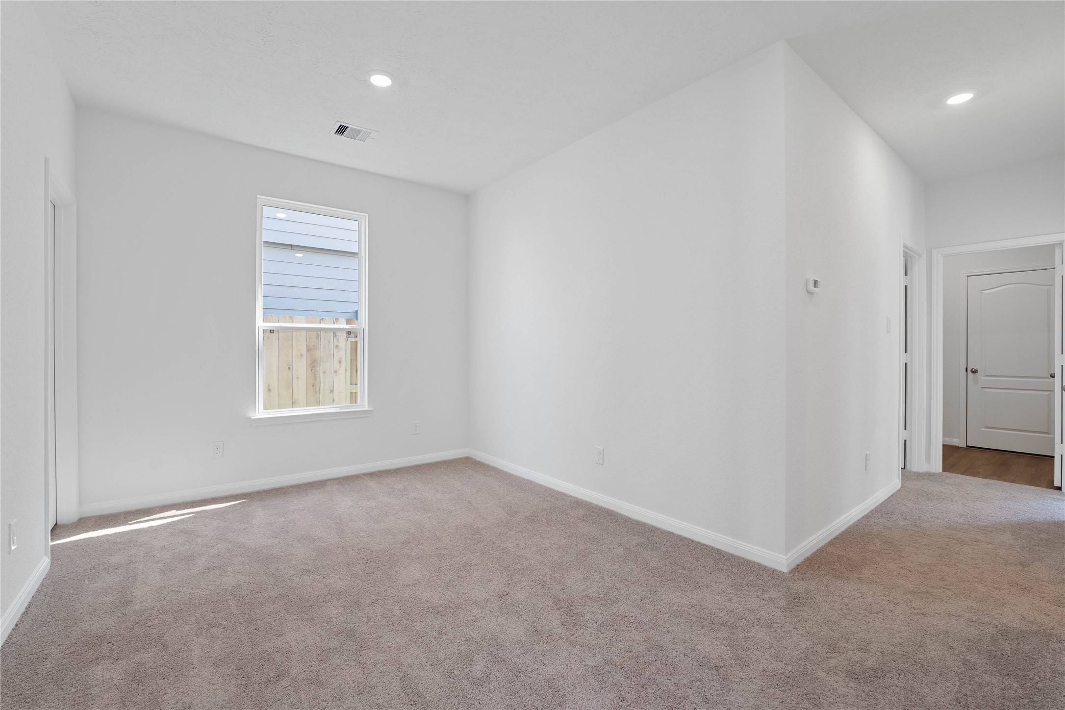 6423 Kentfield Drive Rosharon, TX 77583 - Photo 5 of 26 The Den offers a versatile space that seamlessly expands your living options—perfect for a home office, playroom, media space, or whatever suits your lifestyle. The Den features plush carpet flooring, custom neutral tone paint, high ceilings, recessed lighting, a large window, and a walk-in closet for your storage needs.