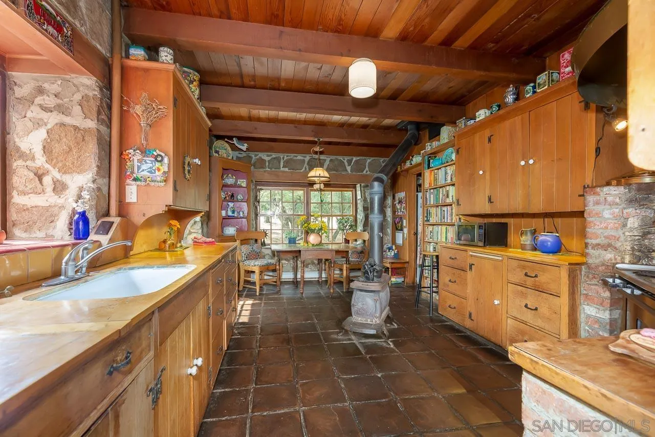 3754 Pine Hills Road Julian, CA 92036 - Photo 11 of 39 a kitchen with sink stove and cabinets
