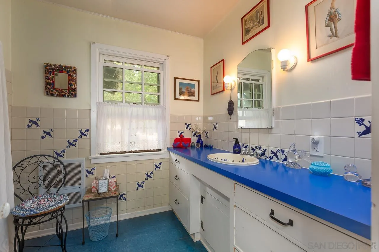 3754 Pine Hills Road Julian, CA 92036 - Photo 13 of 39 a bathroom with a granite countertop sink and a mirror