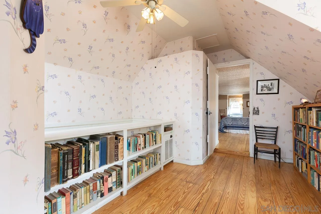3754 Pine Hills Road Julian, CA 92036 - Photo 16 of 39 a view of a hallway with wooden floor and staircase