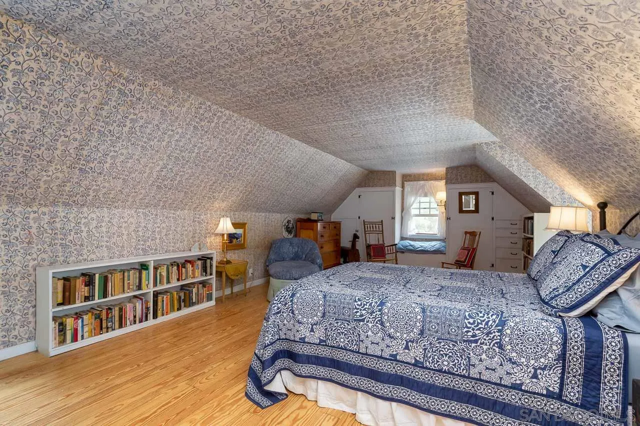 3754 Pine Hills Road Julian, CA 92036 - Photo 18 of 39 a bedroom with a large bed and a bookshelf