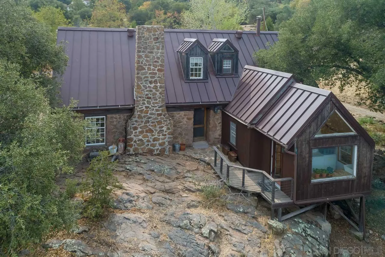 3754 Pine Hills Road Julian, CA 92036 - Photo 26 of 39 a view of a small house with wooden fence
