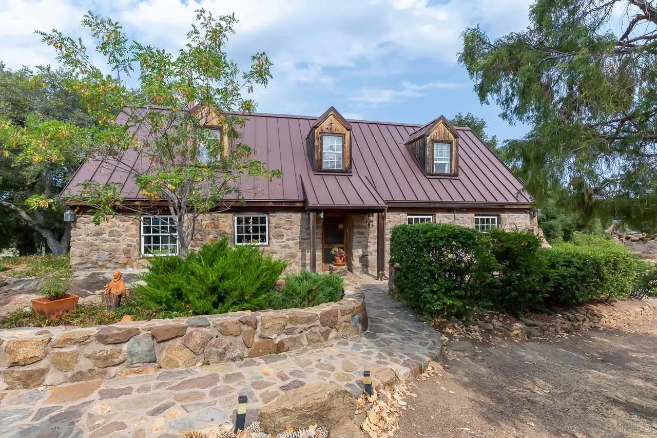 3754 Pine Hills Road Julian, CA 92036 - Photo 32 of 39 a front view of a house with a garden