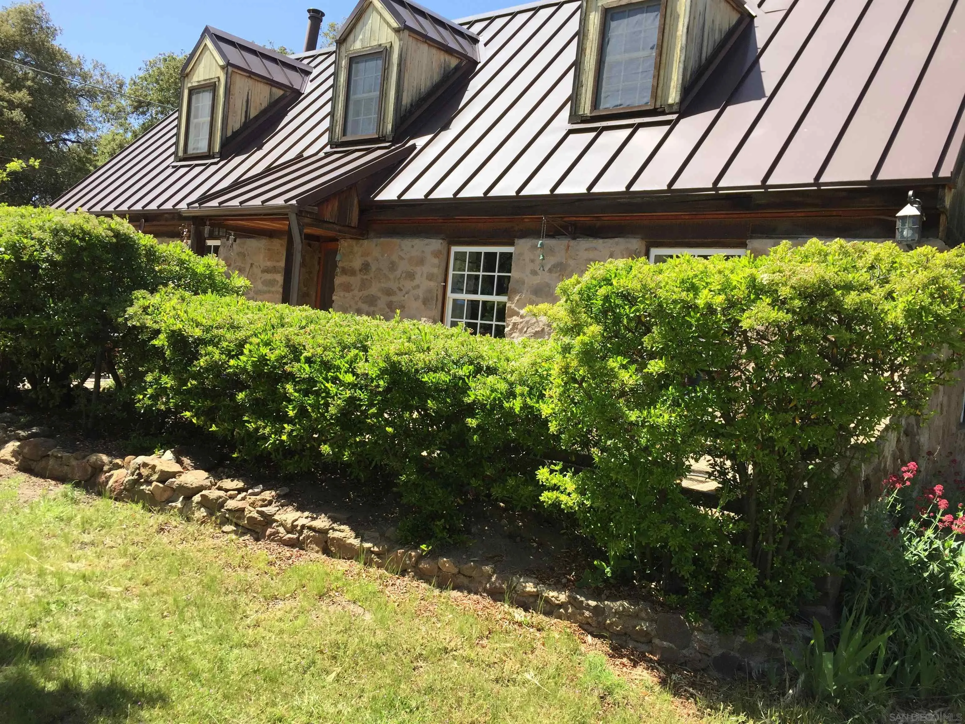 3754 Pine Hills Road Julian, CA 92036 - Photo 37 of 39 a front view of a house with a yard