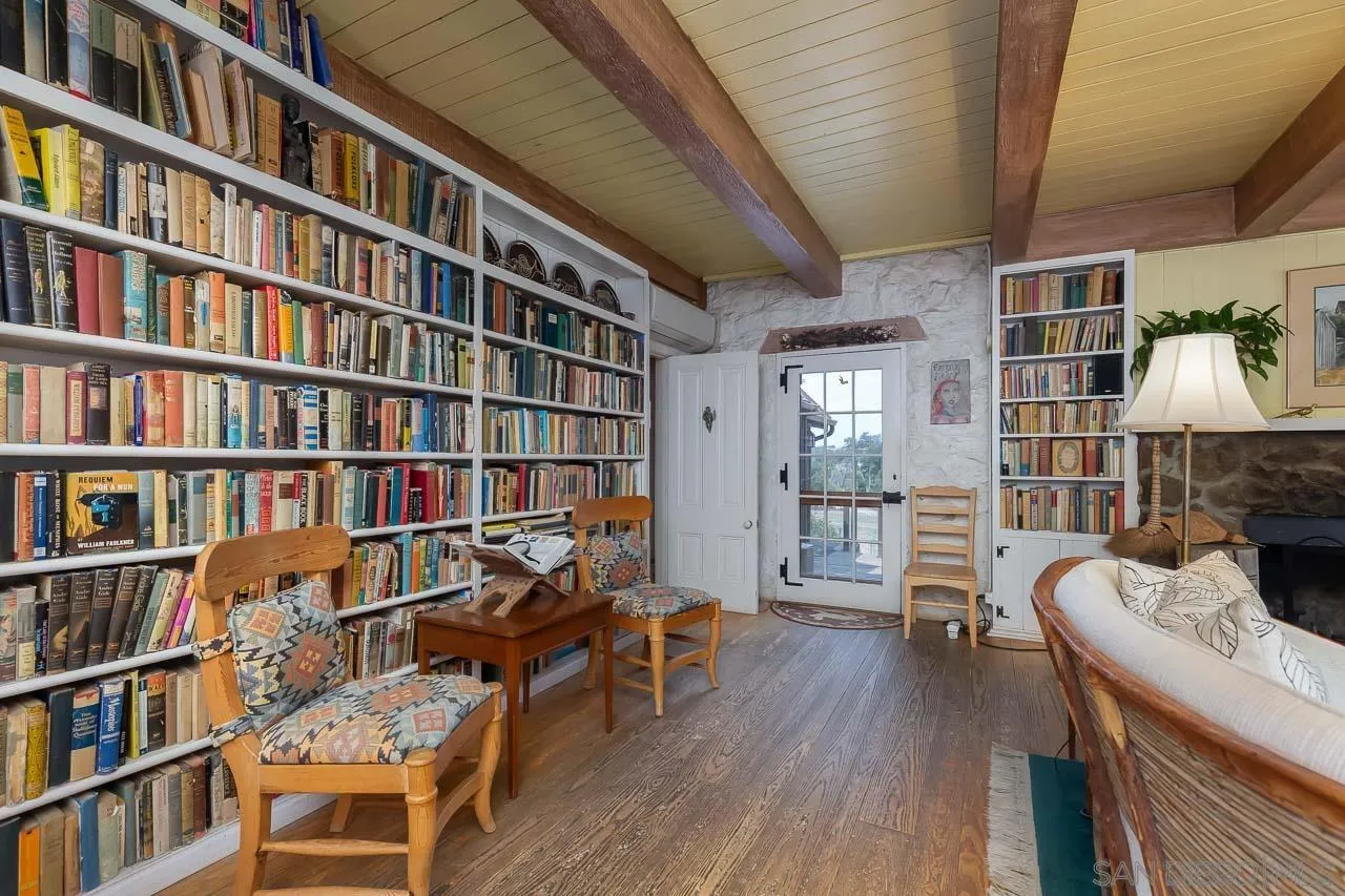 3754 Pine Hills Road Julian, CA 92036 - Photo 6 of 39 a living room with furniture and a book shelf