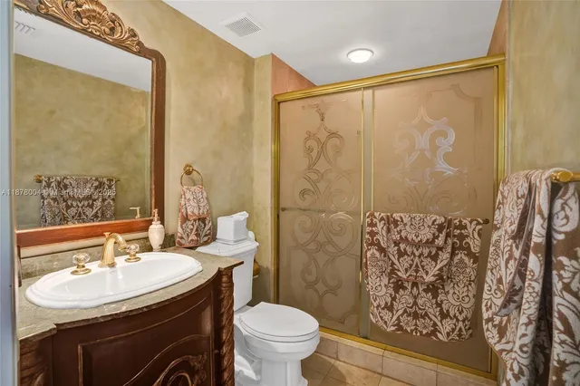 a bedroom with two beds and a large window