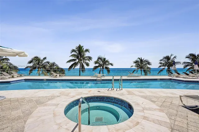 a tall building with a tree in front of it