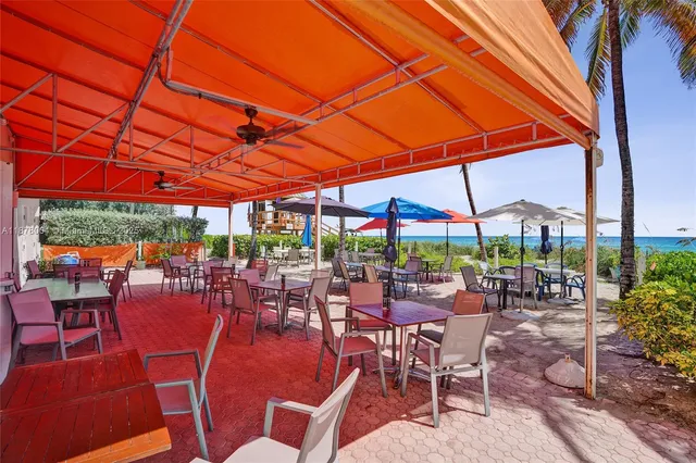 a view of a street with potted plants