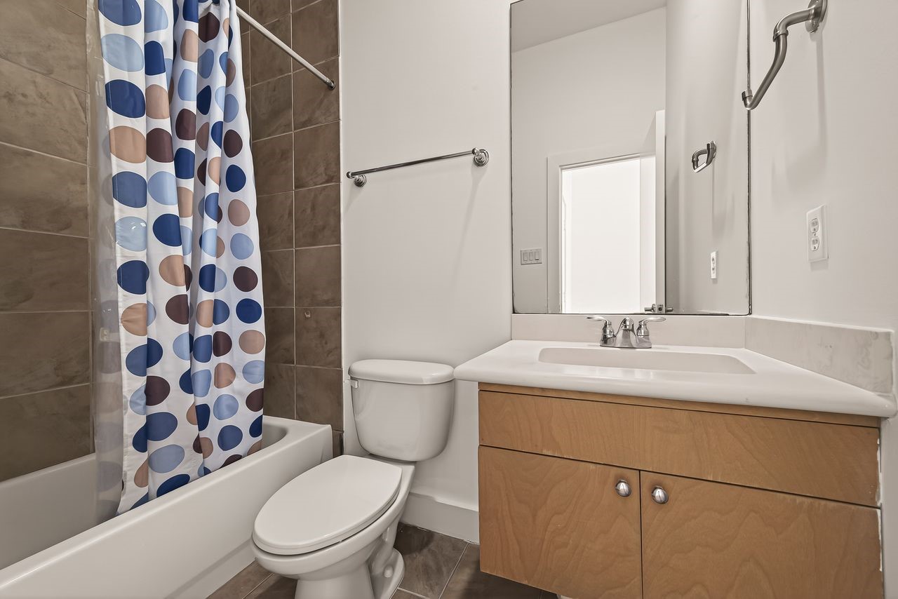 724 Ruthven Street Houston, TX 77019 - Photo 31 of 45 a bathroom with a sink toilet vanity and shower