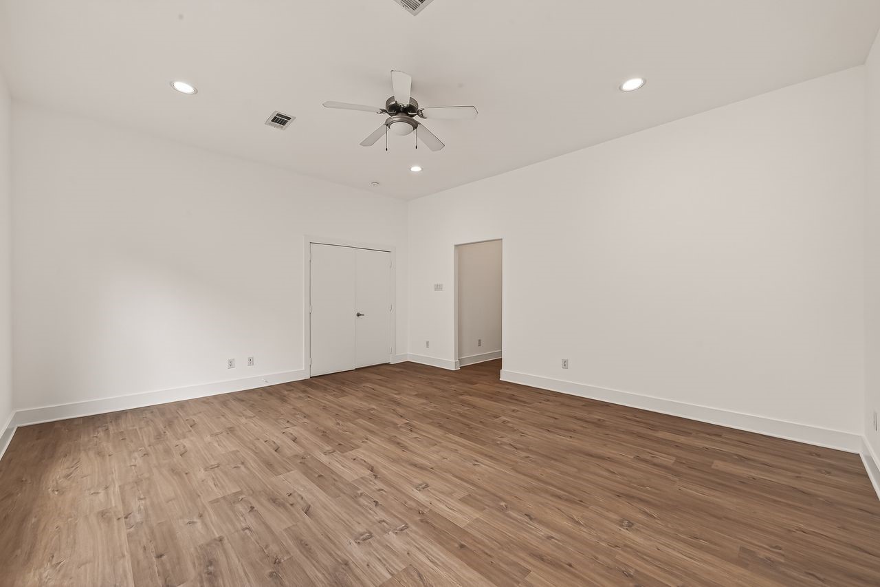 724 Ruthven Street Houston, TX 77019 - Photo 33 of 45 wooden floor in an empty room