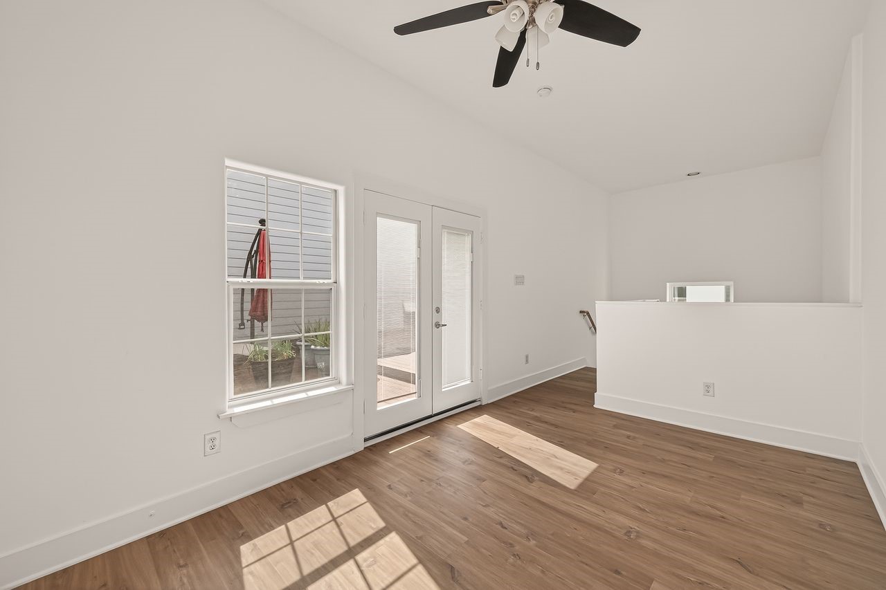 724 Ruthven Street Houston, TX 77019 - Photo 42 of 45 a view of empty room with wooden floor and window
