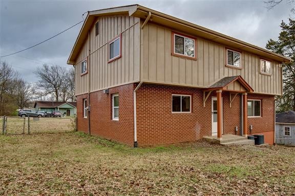 256 Manzano Road Madison, TN 37115 - Photo 22 of 24 a front view of a house with a yard