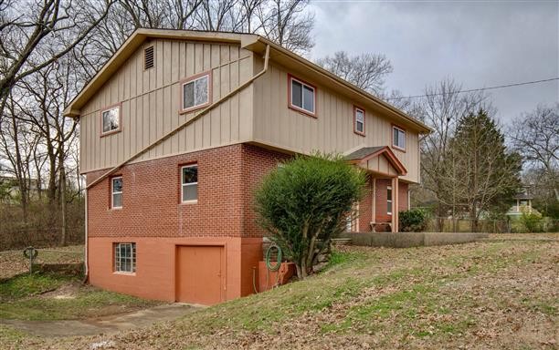 256 Manzano Road Madison, TN 37115 - Photo 23 of 24 a front view of a house with a yard
