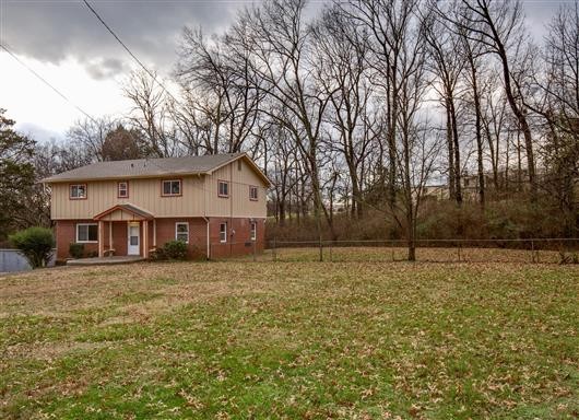 256 Manzano Road Madison, TN 37115 - Photo 24 of 24 a front view of a house with a yard