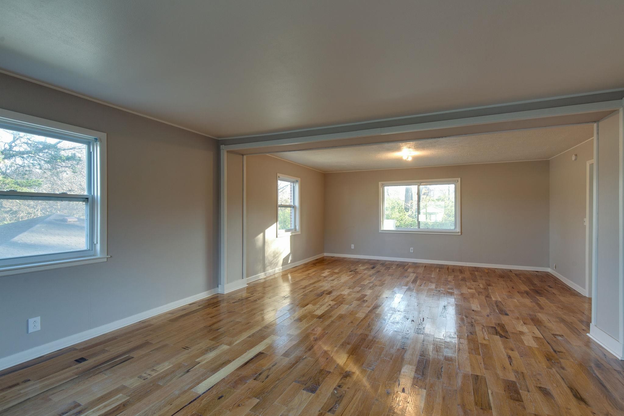 256 Manzano Road Madison, TN 37115 - Photo 3 of 24 wooden floor in an empty room with a window