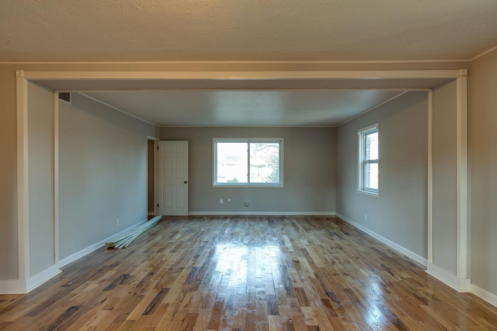 256 Manzano Road Madison, TN 37115 - Photo 4 of 24 a view of empty room with wooden floor and fan