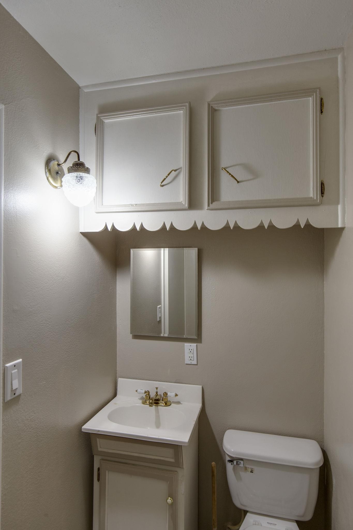 256 Manzano Road Madison, TN 37115 - Photo 8 of 24 a bathroom with a sink a toilet and mirror