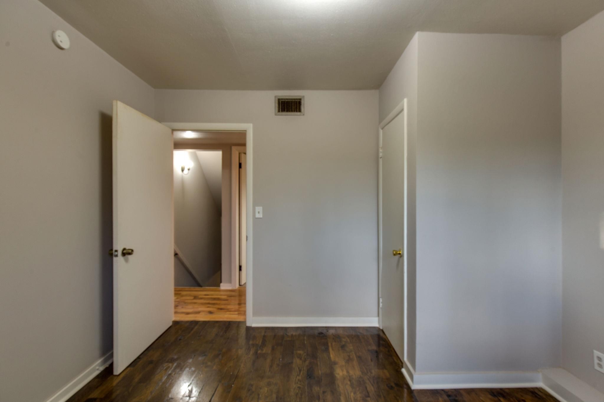 256 Manzano Road Madison, TN 37115 - Photo 9 of 24 an empty room with wooden floor