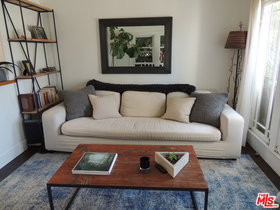 908 Victoria Avenue Venice, CA 90291 - Photo 5 of 25 a living room with furniture and a couch