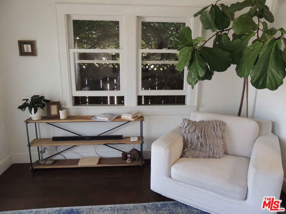 908 Victoria Avenue Venice, CA 90291 - Photo 6 of 25 a living room with furniture a window and a potted plant