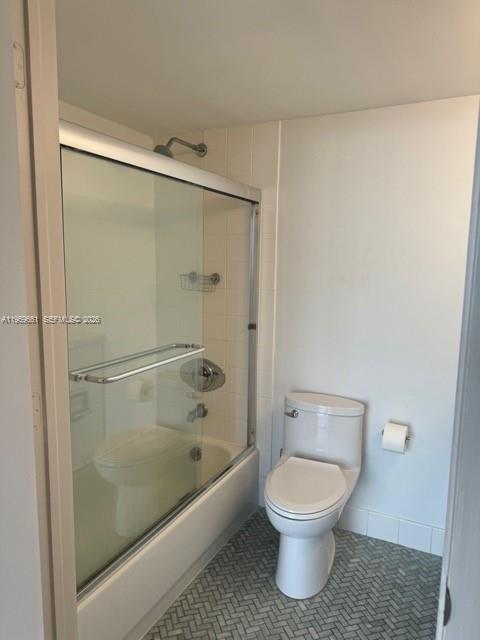 1621 Bay Road, Unit 708 Miami Beach, FL 33139 - Photo 2 of 13 a bathroom with a toilet and a shower