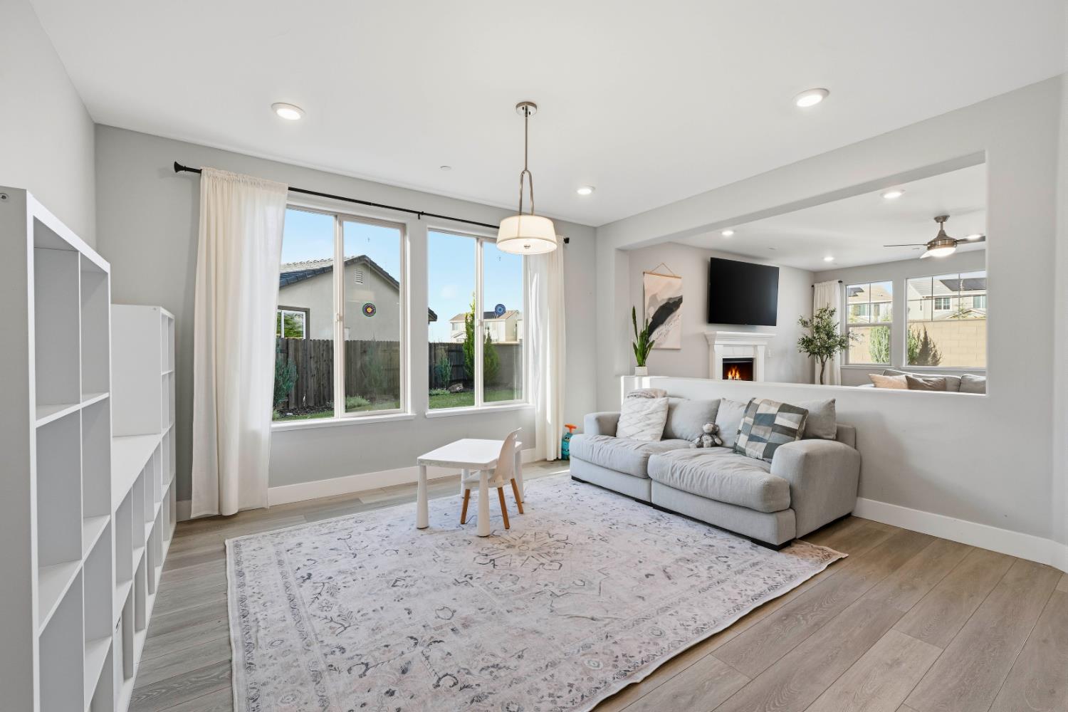 810 Broken Bit Court Rocklin, CA 95765 - Photo 13 of 47 a living room with furniture and a chandelier
