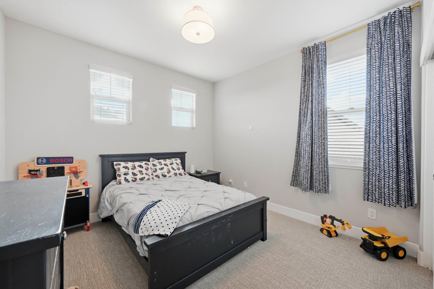 810 Broken Bit Court Rocklin, CA 95765 - Photo 25 of 47 a bedroom with a bed and a window