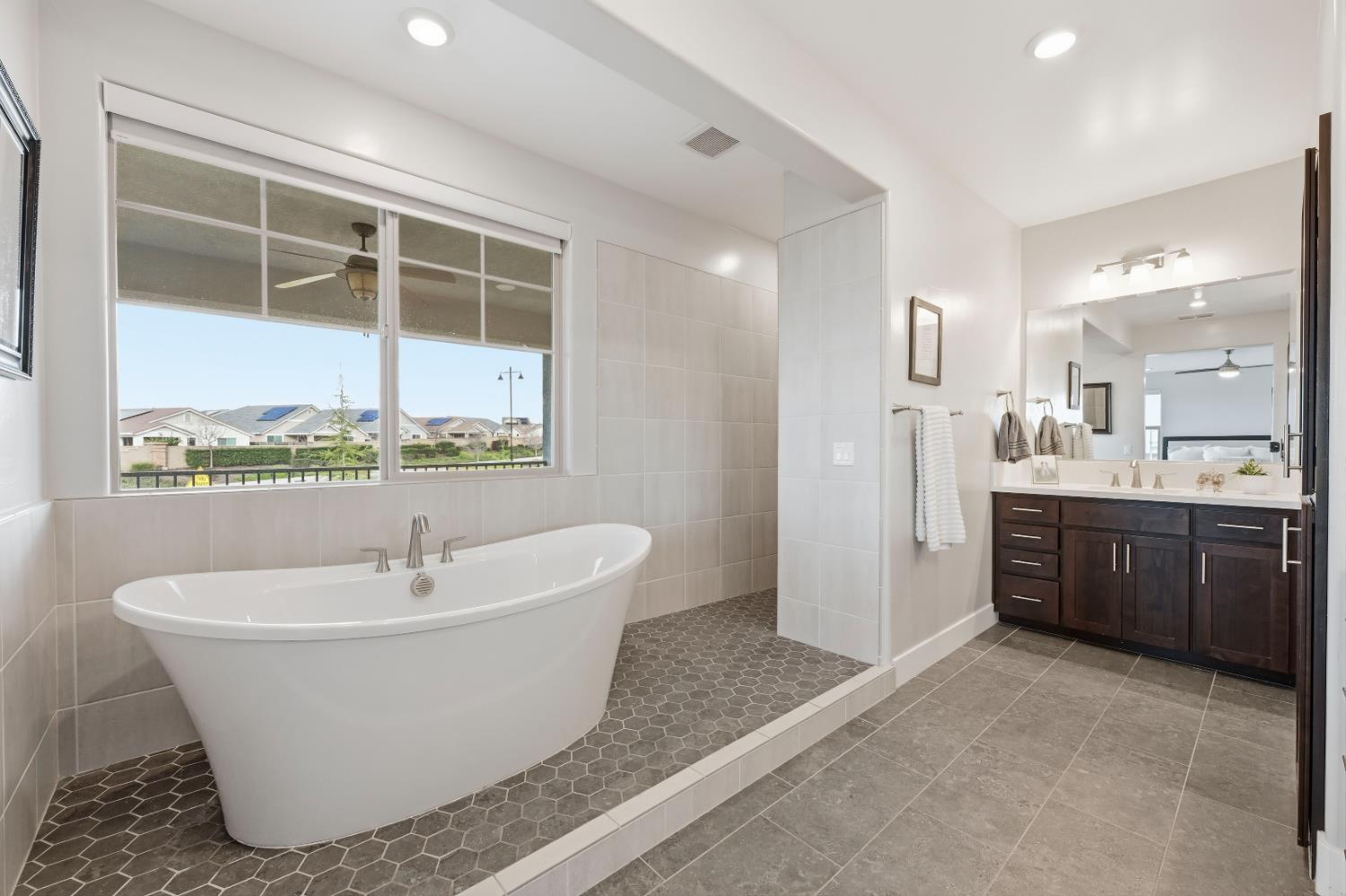 810 Broken Bit Court Rocklin, CA 95765 - Photo 27 of 47 a white bath tub sitting next to a bathroom