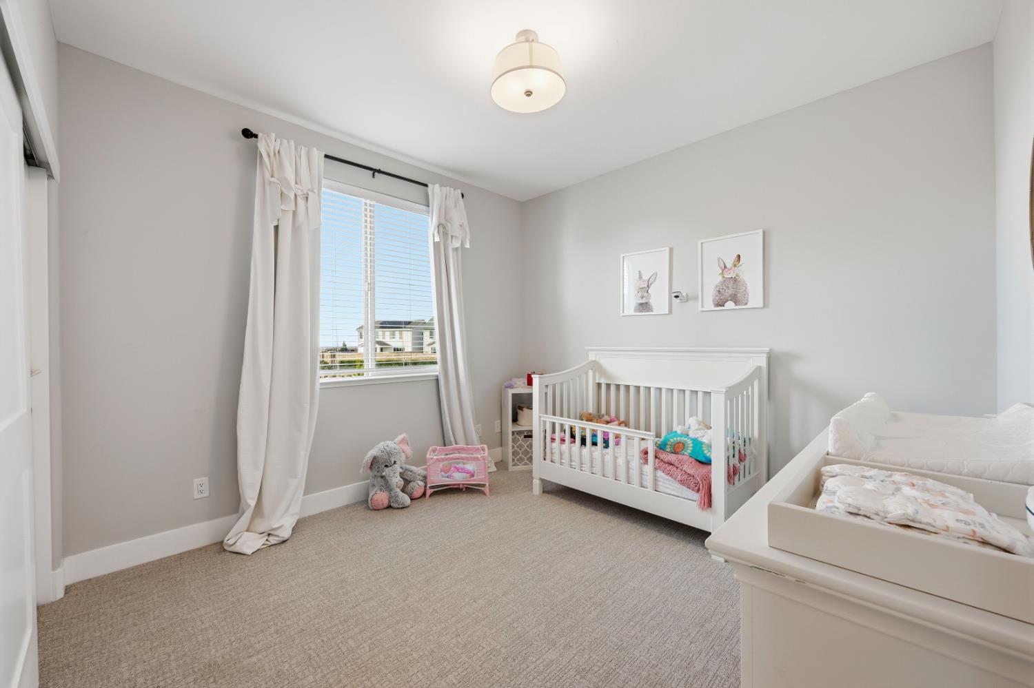 810 Broken Bit Court Rocklin, CA 95765 - Photo 30 of 47 a bedroom with furniture and a window