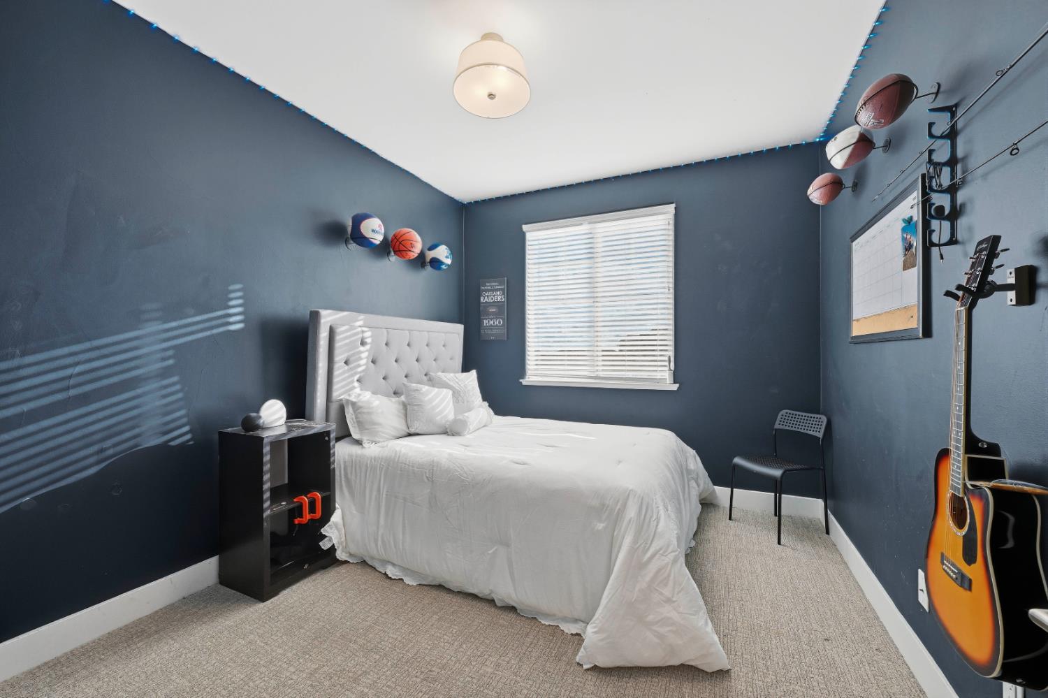 810 Broken Bit Court Rocklin, CA 95765 - Photo 33 of 47 a bedroom with a bed and a flat tv screen on the dresser