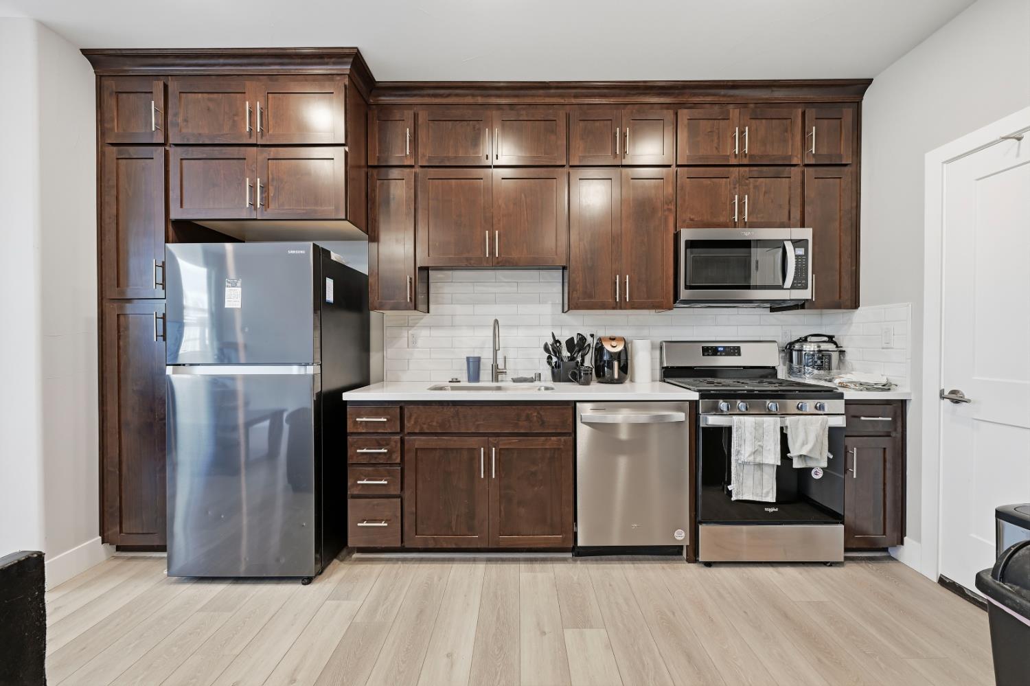 810 Broken Bit Court Rocklin, CA 95765 - Photo 36 of 47 a kitchen with stainless steel appliances granite countertop a refrigerator and a stove top oven