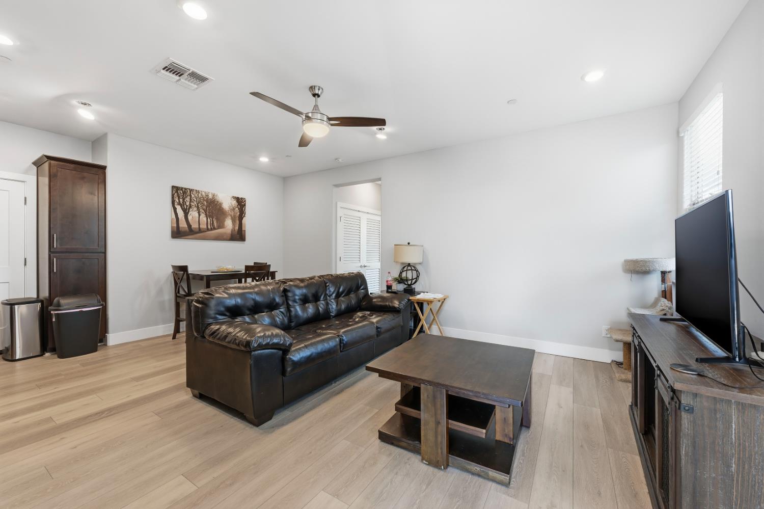 810 Broken Bit Court Rocklin, CA 95765 - Photo 37 of 47 a living room with furniture and a flat screen tv