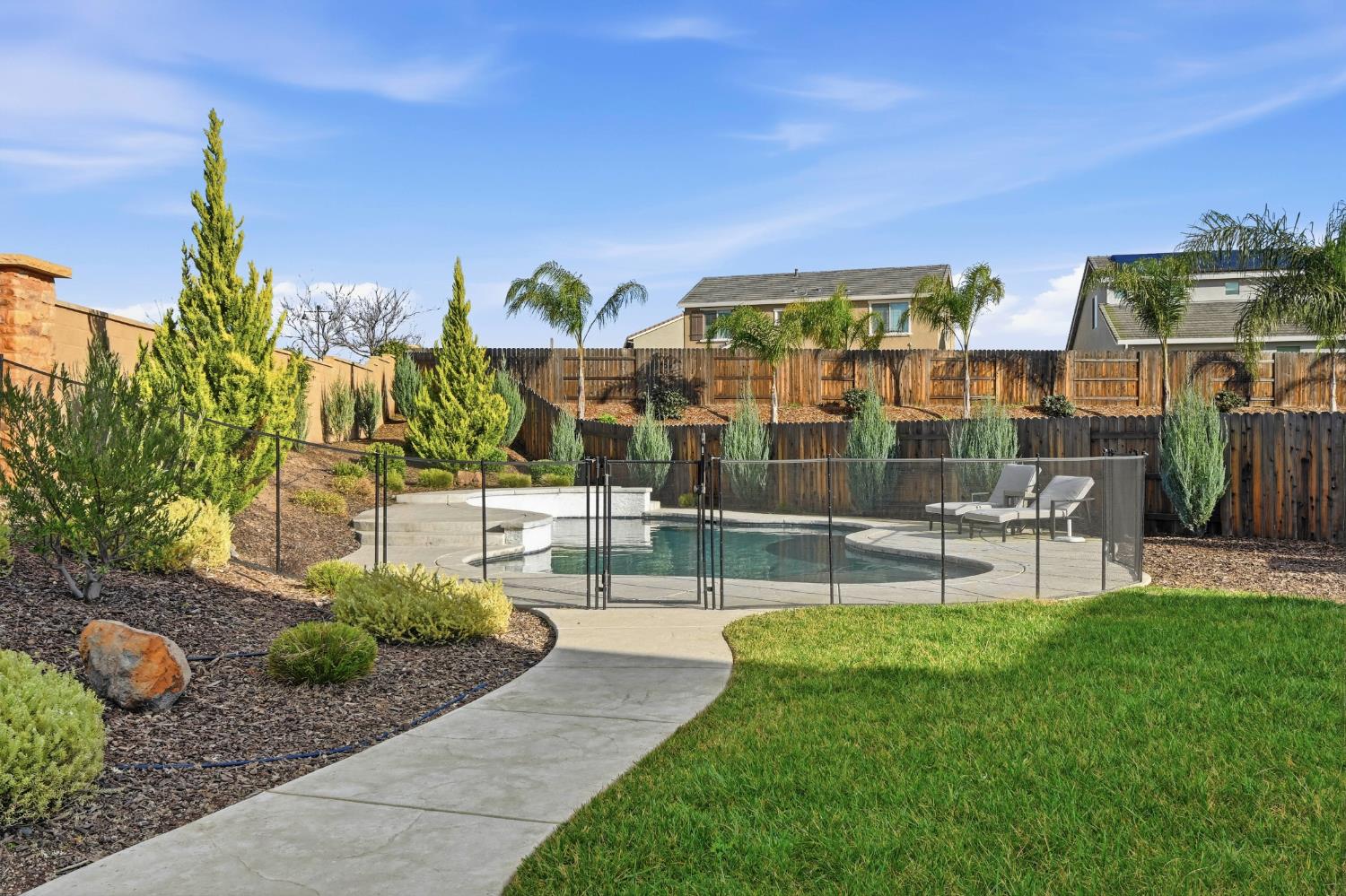 810 Broken Bit Court Rocklin, CA 95765 - Photo 43 of 47 a view of swimming pool with outdoor seating and plants