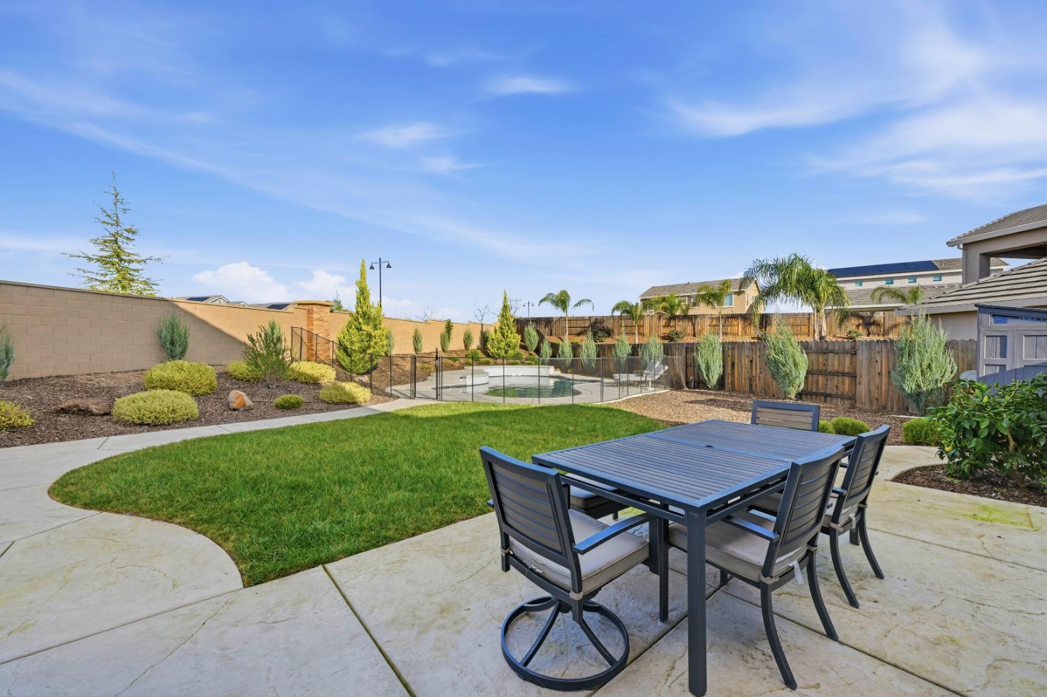 810 Broken Bit Court Rocklin, CA 95765 - Photo 44 of 47 a view of a patio with table and chairs and potted plants
