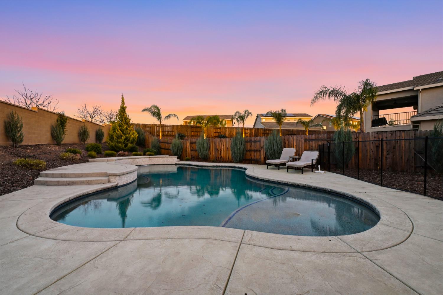810 Broken Bit Court Rocklin, CA 95765 - Photo 5 of 47 a view of a swimming pool with a lounge chair