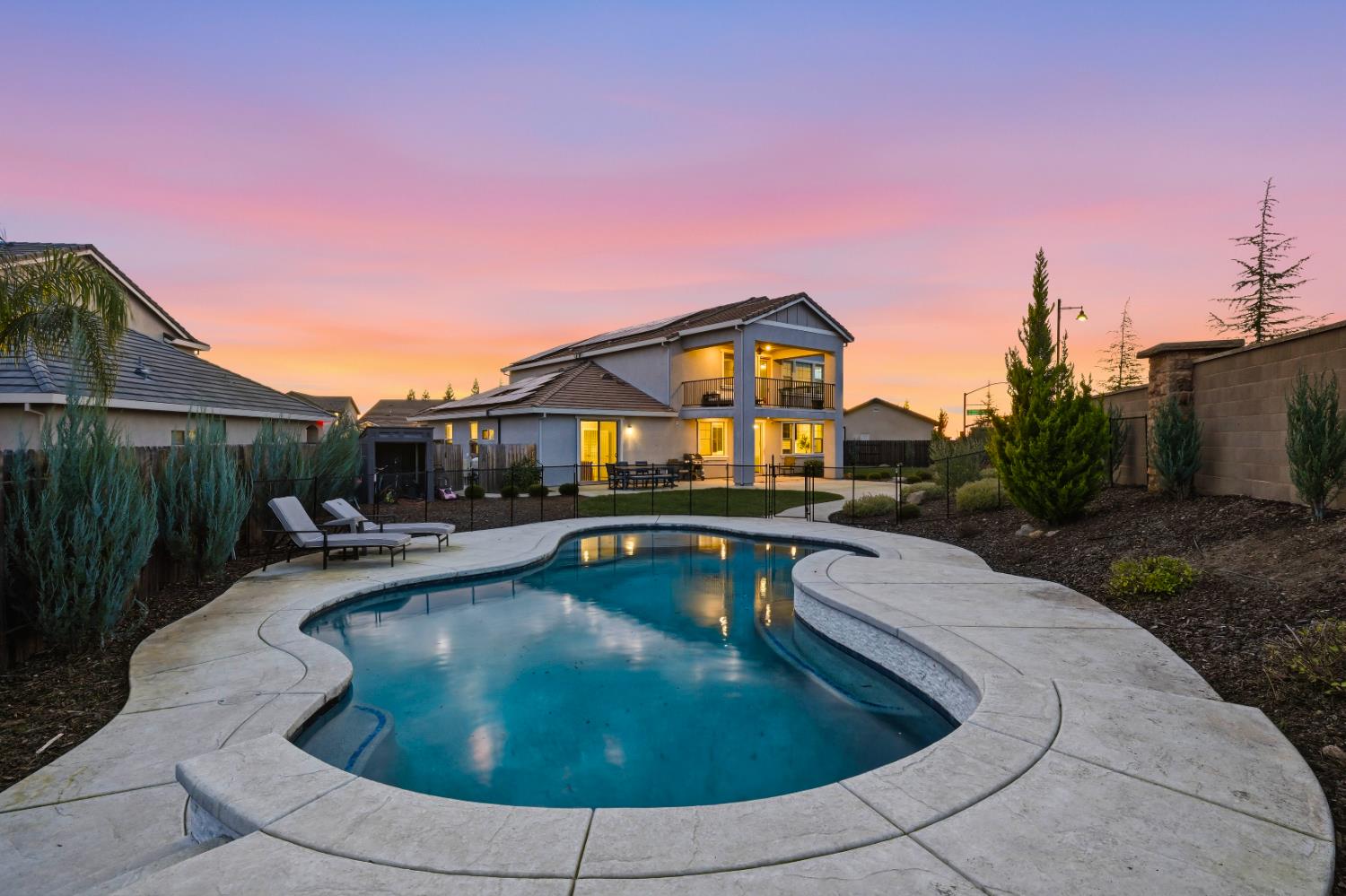 810 Broken Bit Court Rocklin, CA 95765 - Photo 6 of 47 a view of a house with pool fire pit and chairs in patio