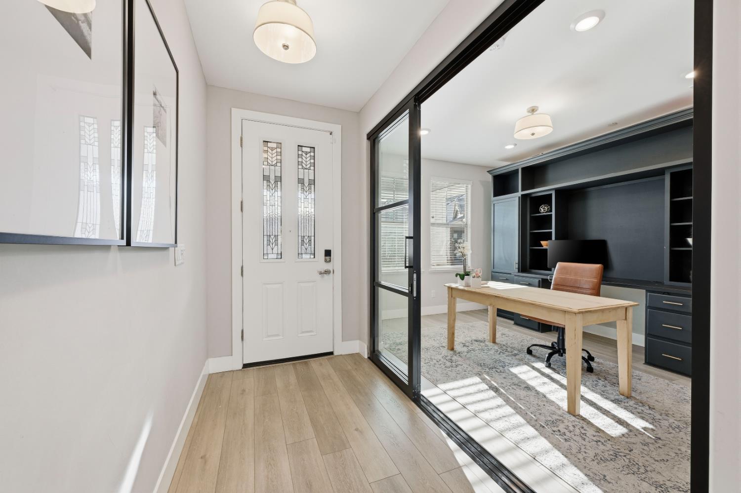 810 Broken Bit Court Rocklin, CA 95765 - Photo 10 of 47 a workspace with wooden floor and a bathroom