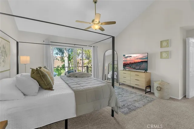 a bedroom with two beds and a chandelier