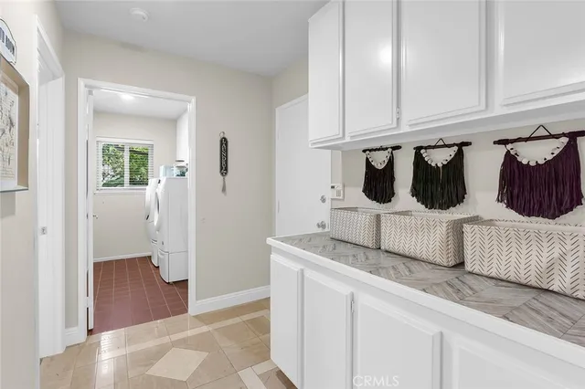 a bathroom with a granite countertop tub and sink