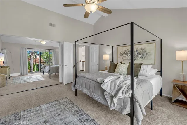 a bed room with a bed and a chandelier