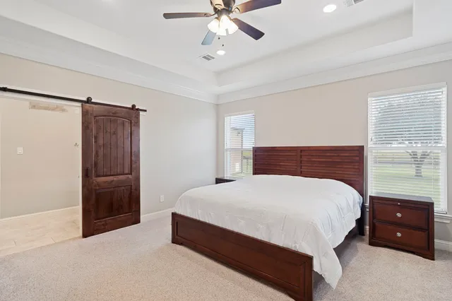 a kitchen with stainless steel appliances granite countertop a stove a refrigerator a oven a sink with a dining table and chairs