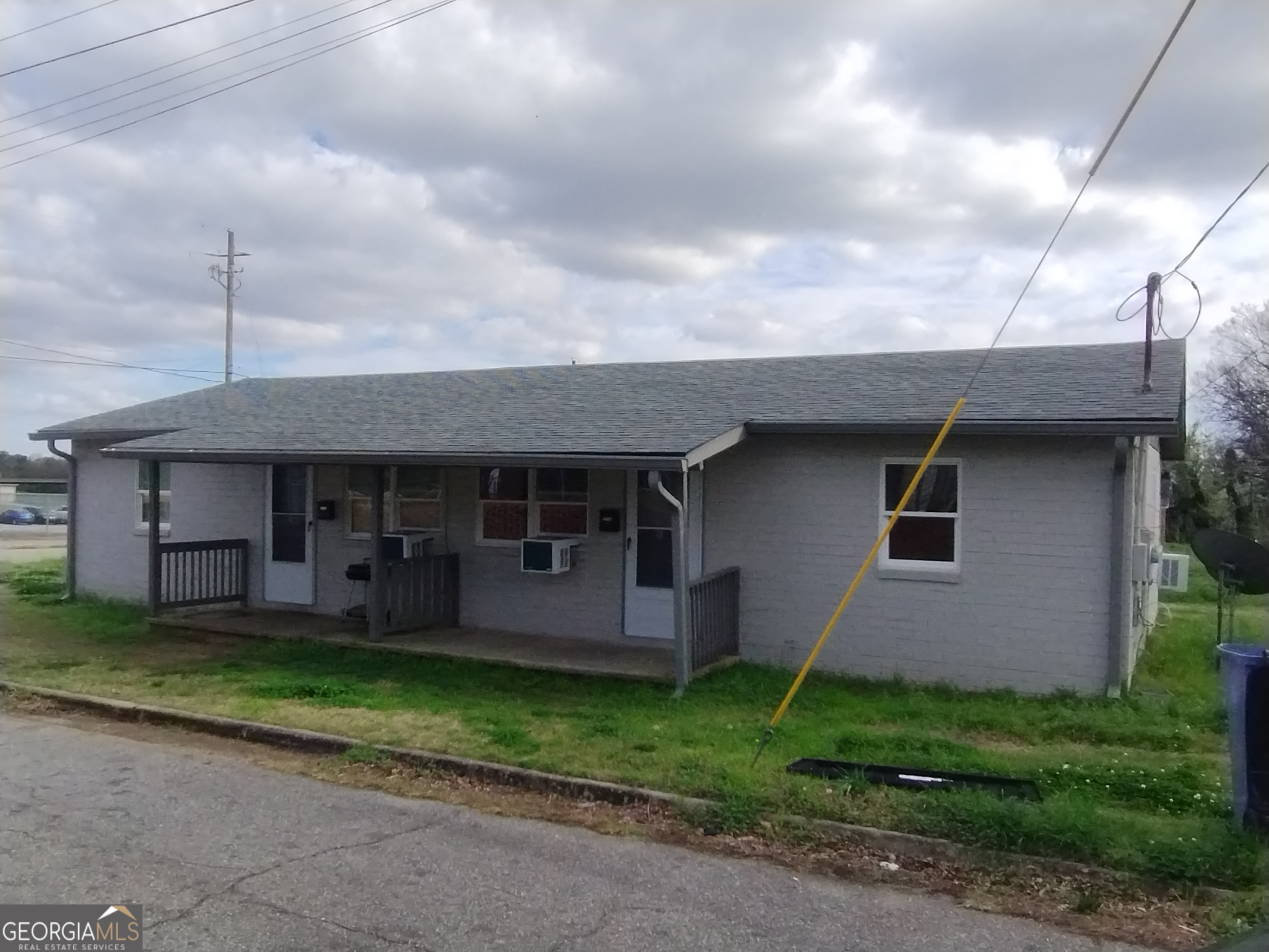 1112 Carroll Street Macon, GA 31206 - Photo 1 of 1 a front view of a house with garden