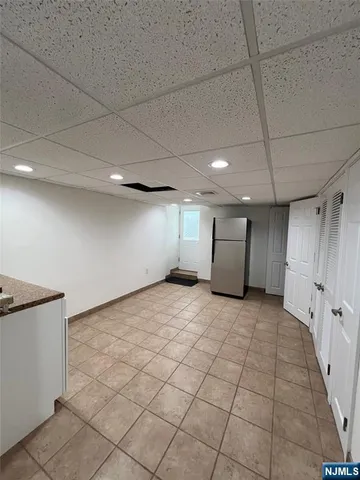 a white toilet sitting next to a bath tub