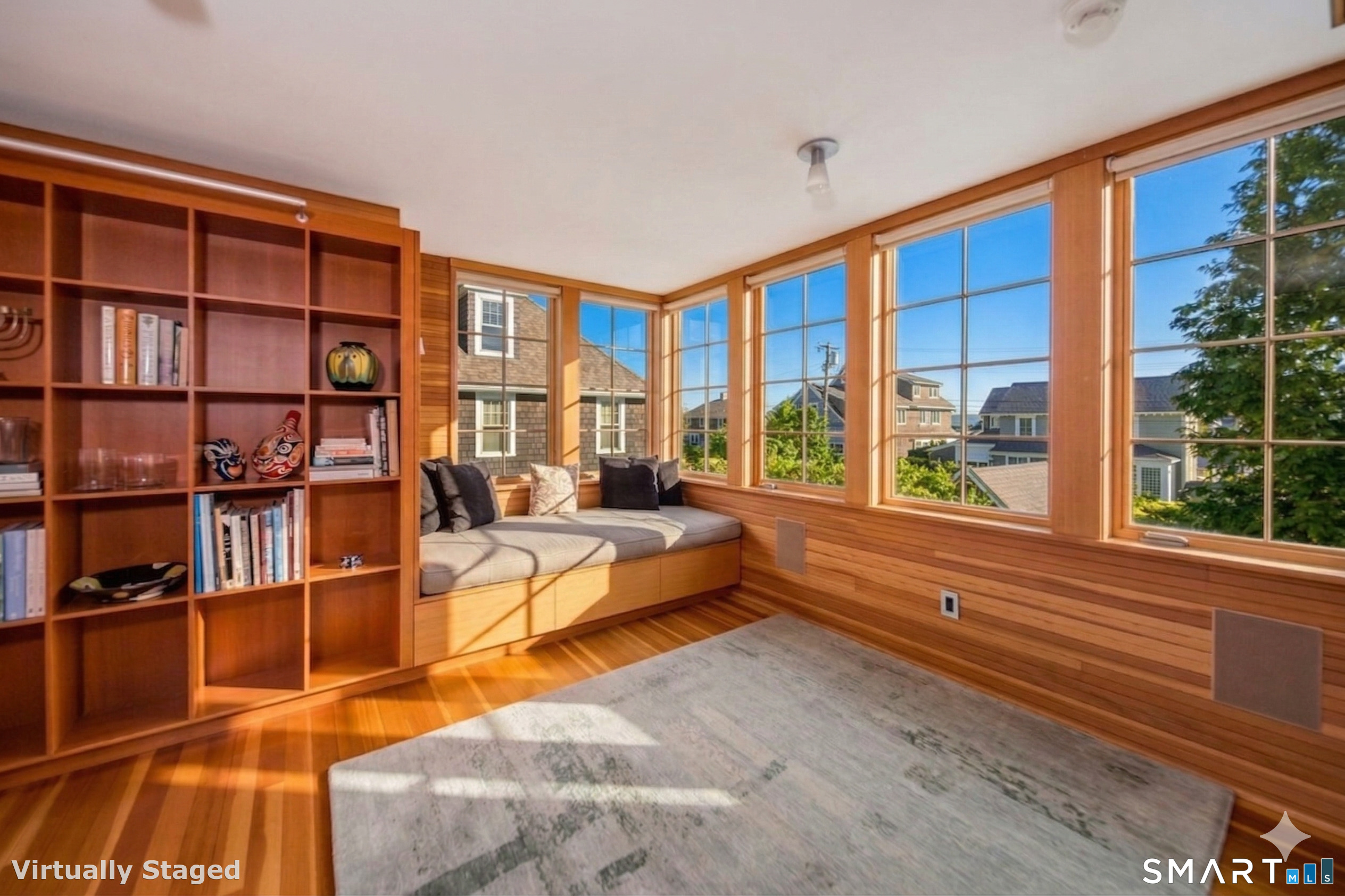 61 Hartford Avenue Madison, CT 06443 - Photo 17 of 75 a living room with furniture cabinets and a large window