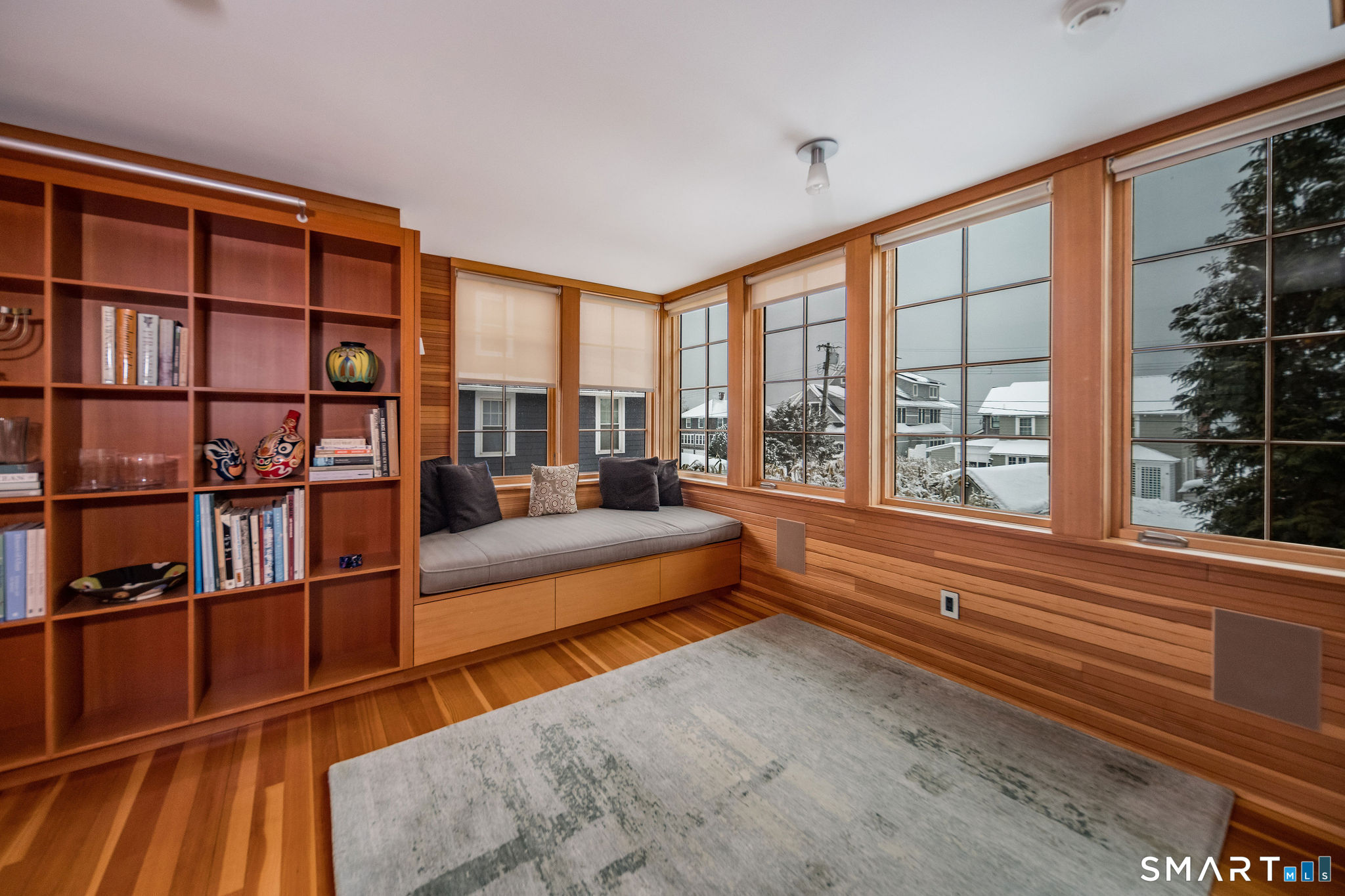 61 Hartford Avenue Madison, CT 06443 - Photo 20 of 75 a living room filled with furniture and a large window