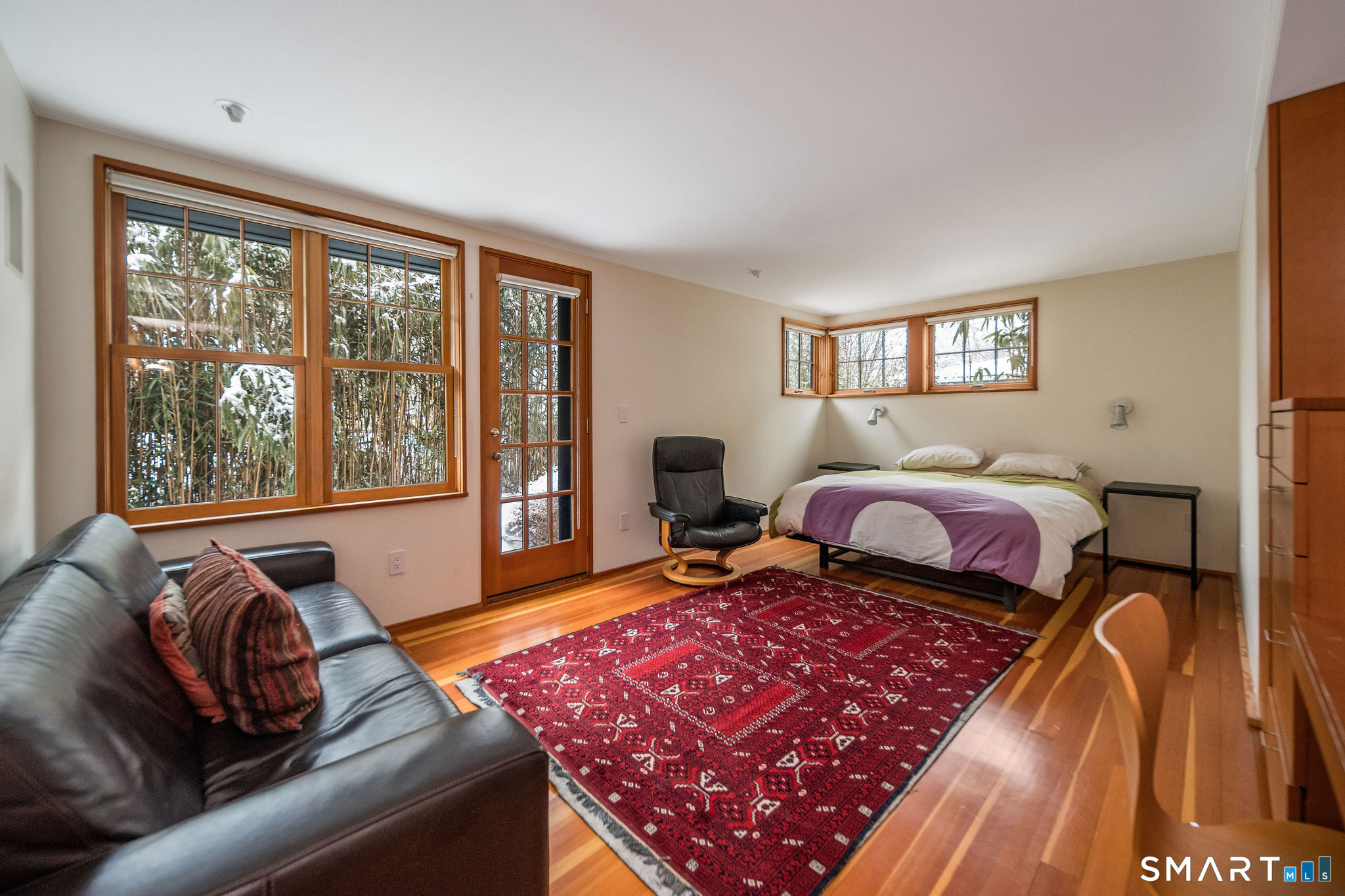 61 Hartford Avenue Madison, CT 06443 - Photo 35 of 40 a bedroom with bed and wooden floor