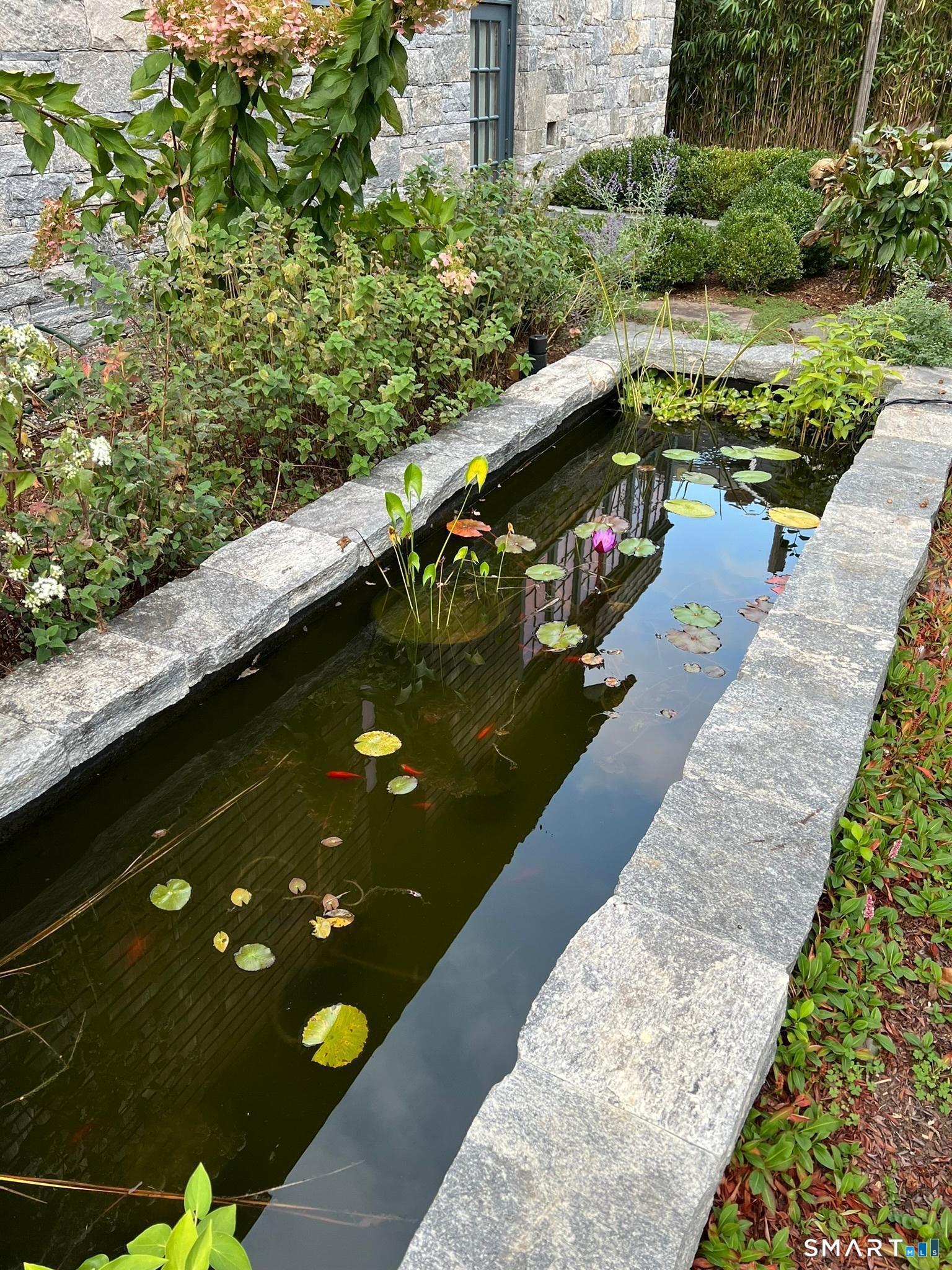 61 Hartford Avenue Madison, CT 06443 - Photo 40 of 40 a view of swimming pool with a table and chairs