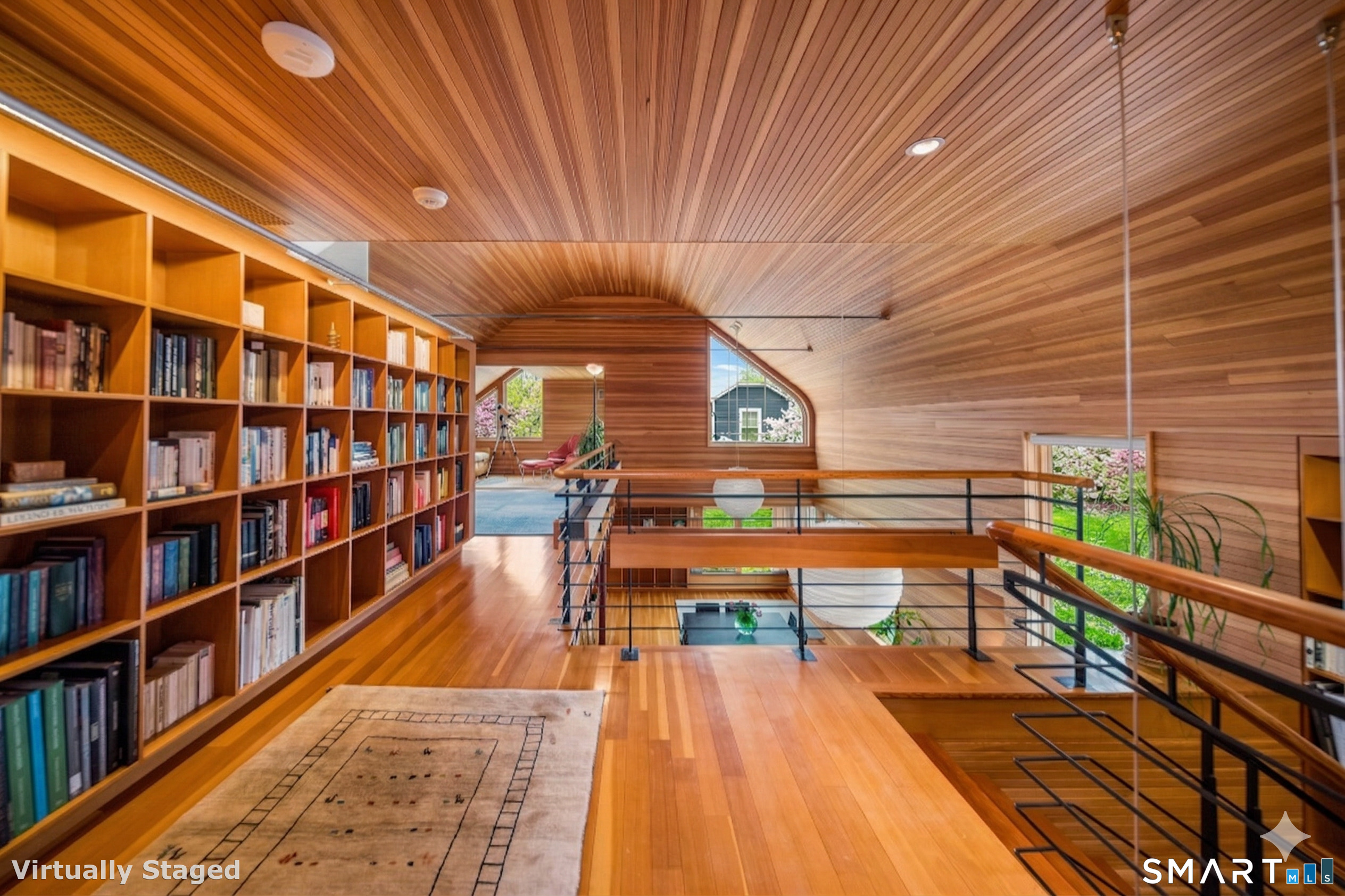 61 Hartford Avenue Madison, CT 06443 - Photo 41 of 75 a room with lots of furniture and a book shelf