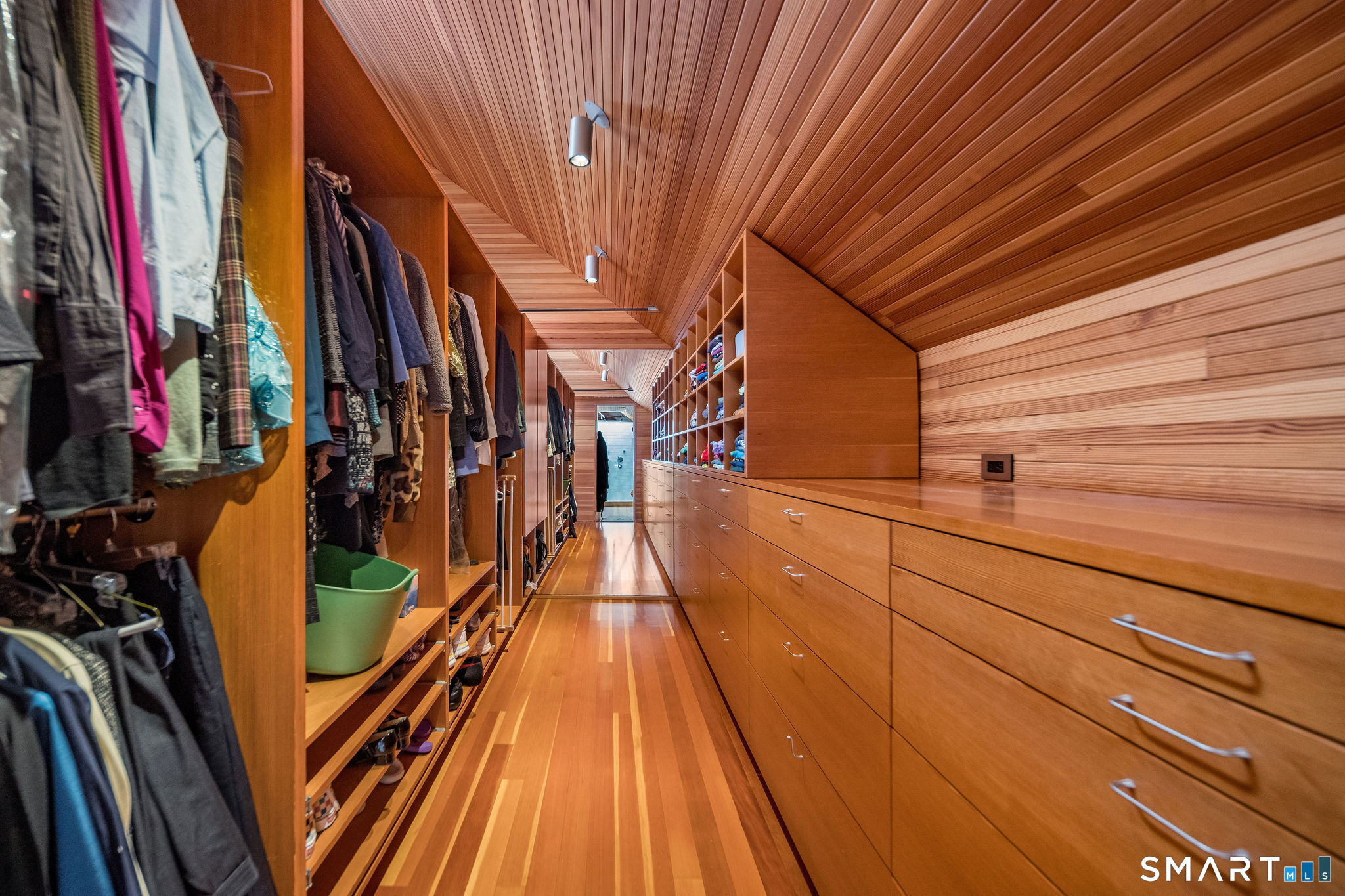 61 Hartford Avenue Madison, CT 06443 - Photo 58 of 75 a view of walk in closet with clothes